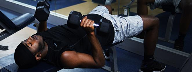 Student lifting weights