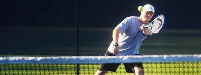 Student playing tennis